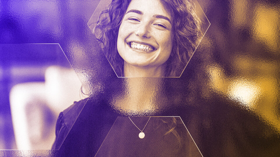 Excited young woman with paper bills in hands finally paying down her mortgage debt at home