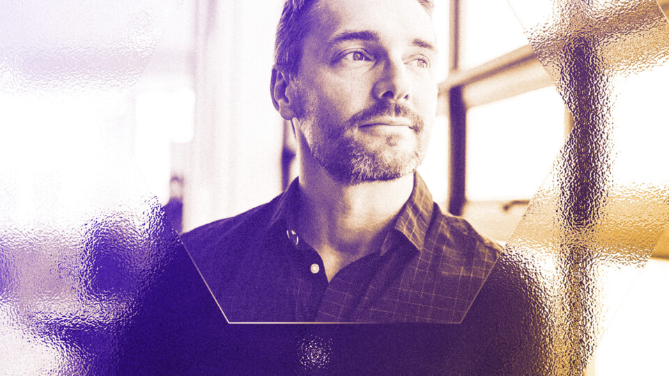 Excited young woman with paper bills in hands finally paying down her mortgage debt at home